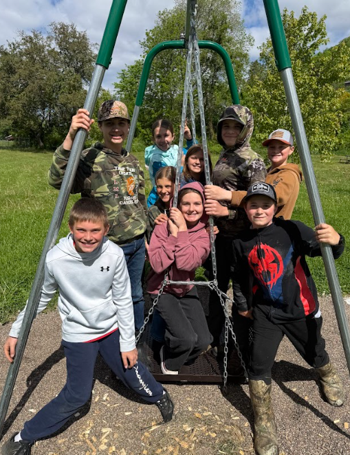 Kids on wheelchair swing. 