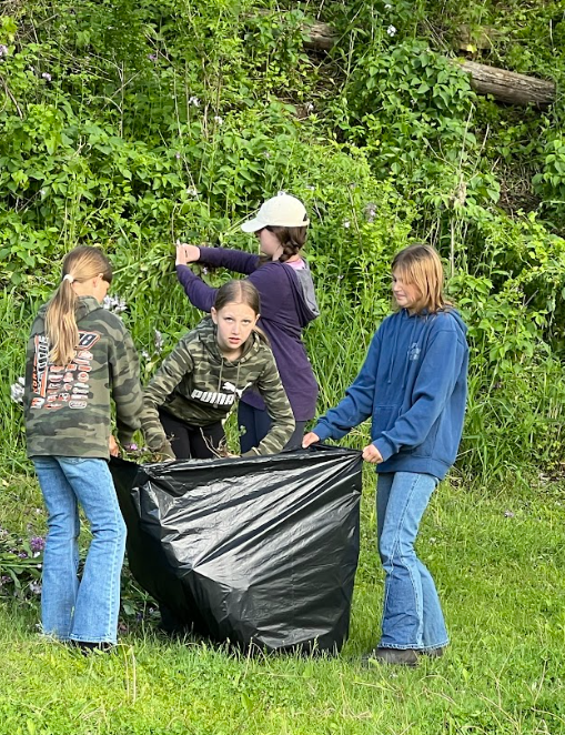 Kids picking invasivie species