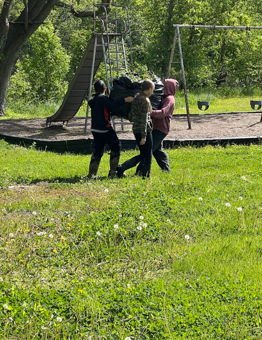 Kids picking invasivie species