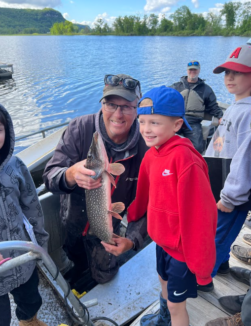 Kid holding a fish