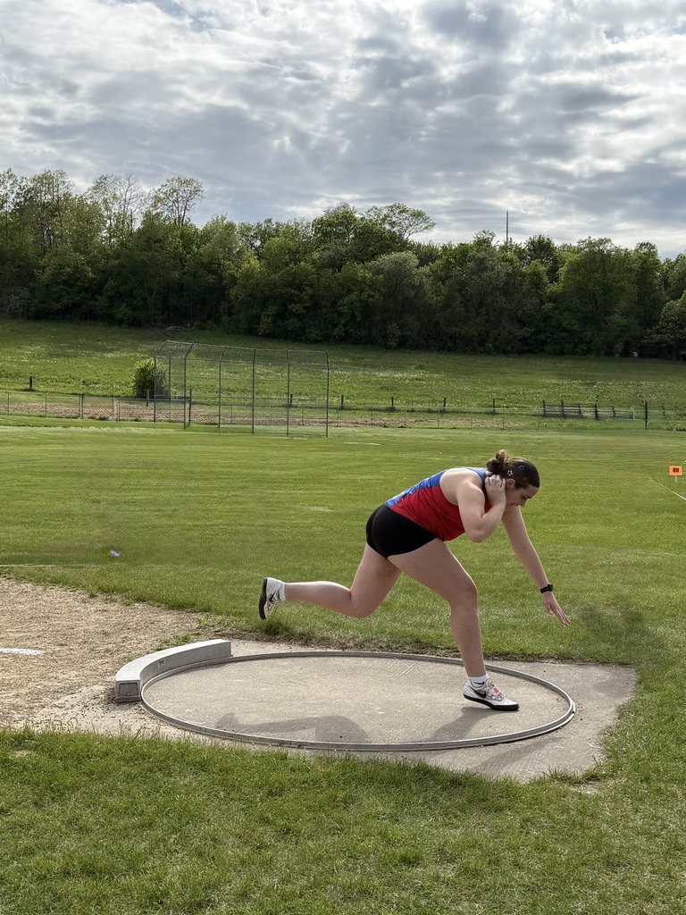 Nessa throwing a shotput. 