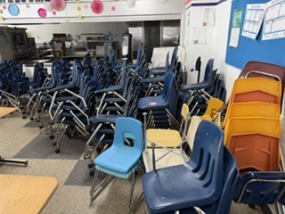 blue plastic chairs with metal legs, some have wheels some don't, used in classrooms, full seat