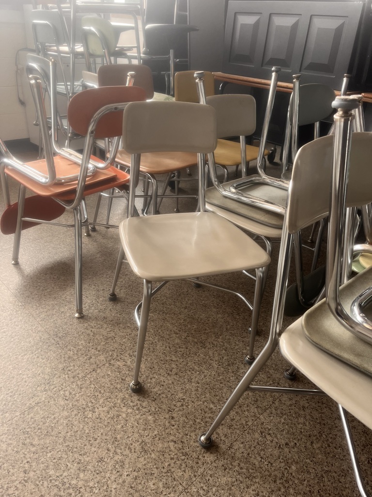 chairs with metal lefts and then hard back rest and seat in a variety of colors, was used in classrooms