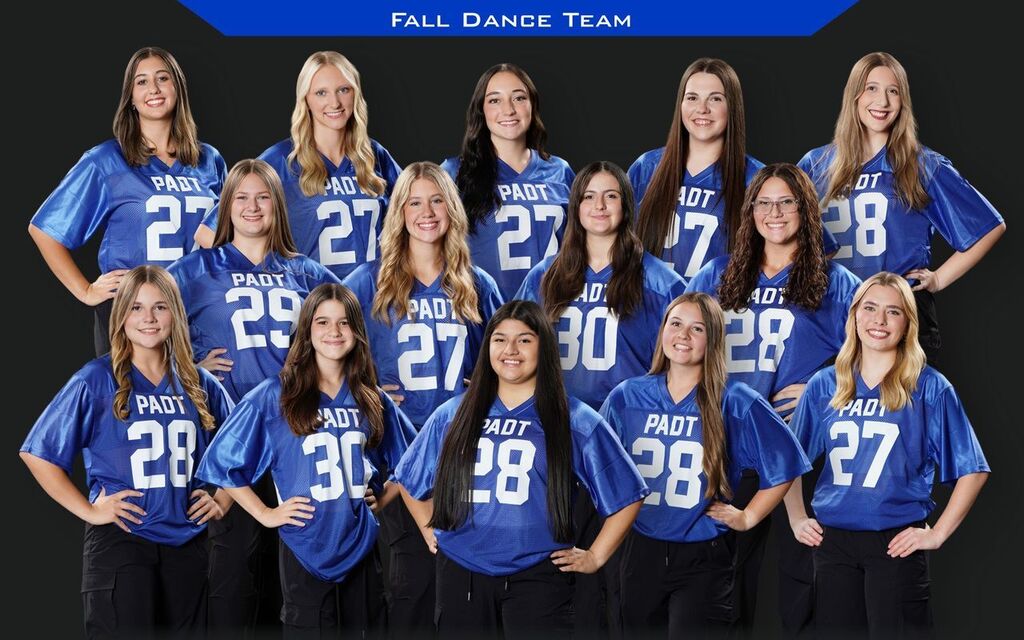 Fall dance team group photo featuring 13 students wearing blue PAOT jerseys and black pants, posed in three rows against a black background with a blue “FALL DANCE TEAM” banner at the top.