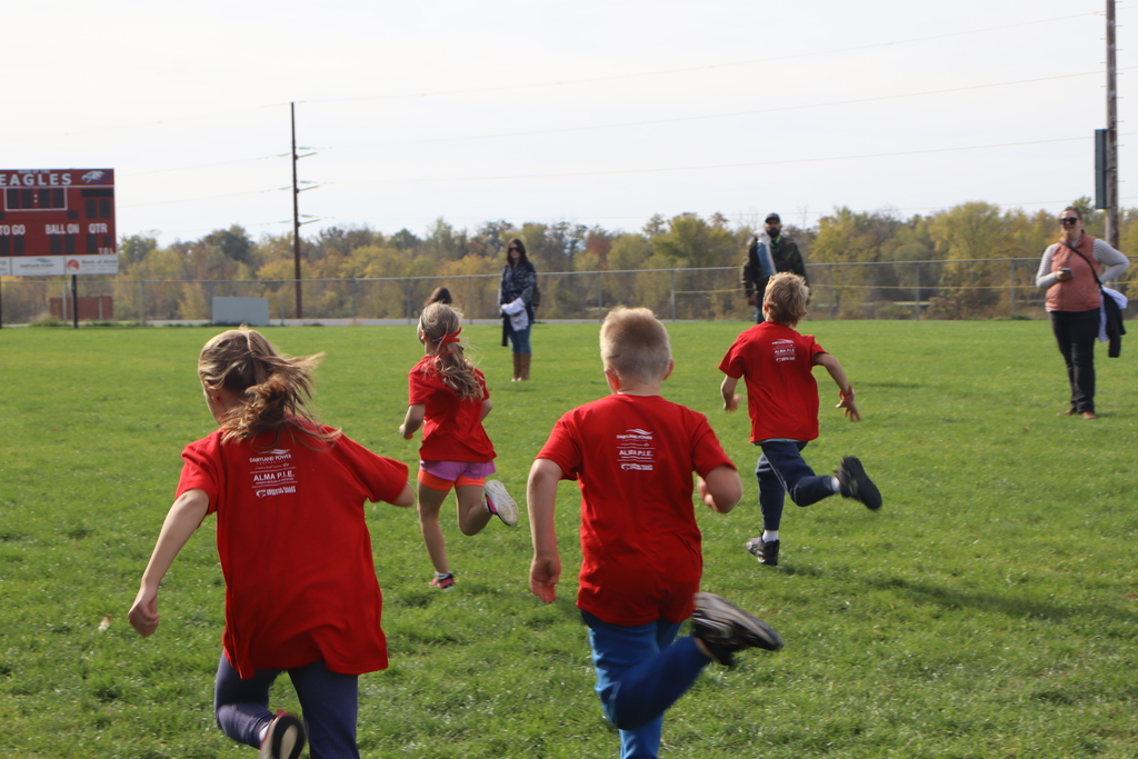 Four students racing against each other.