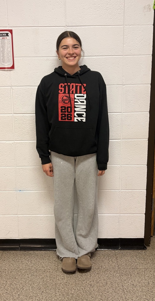 Imani Lopez-Elliot standing in front of a white wall in a black 2026 state dance hoodie and grey sweatpants.