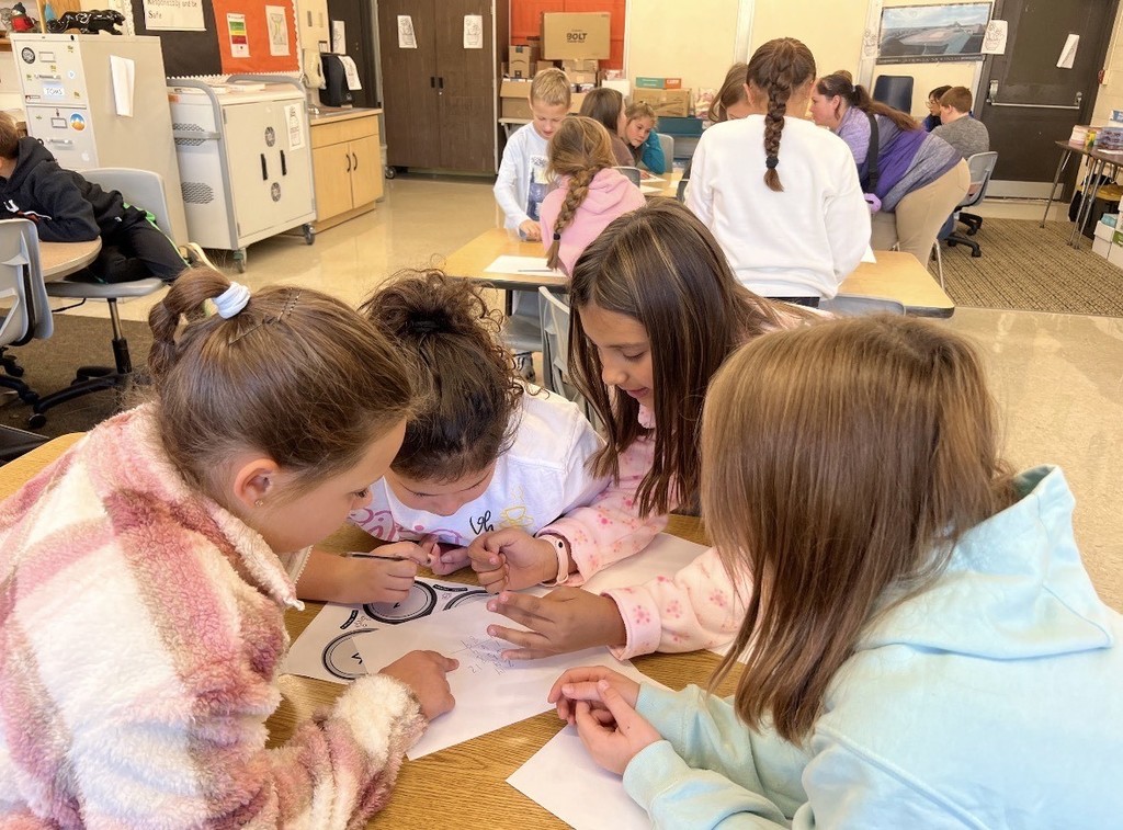 Four students do an SEL activity together