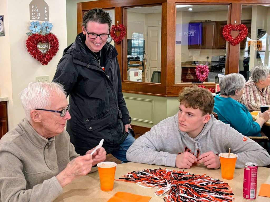 Varsity Boys Basketball team volunteering at Arbor Grove