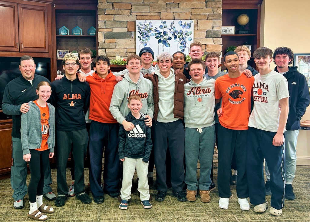 Varsity Boys Basketball team volunteering at Arbor Grove