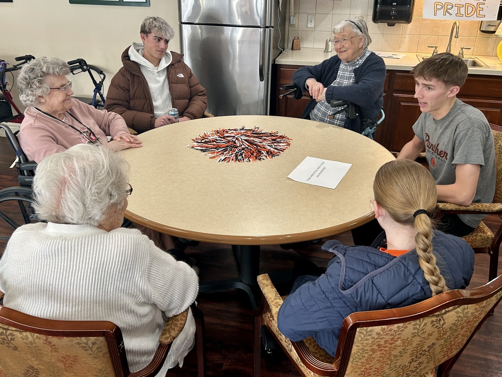Varsity Boys Basketball team volunteering at Arbor Grove