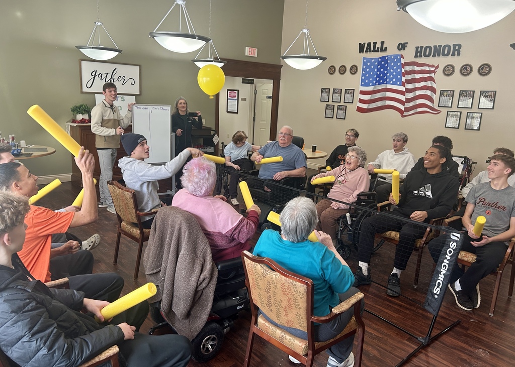 Varsity Boys Basketball team volunteering at Arbor Grove