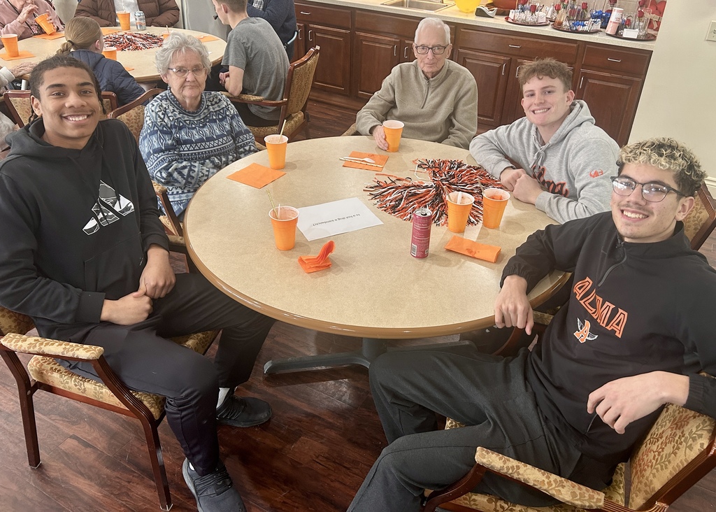 Varsity Boys Basketball team volunteering at Arbor Grove