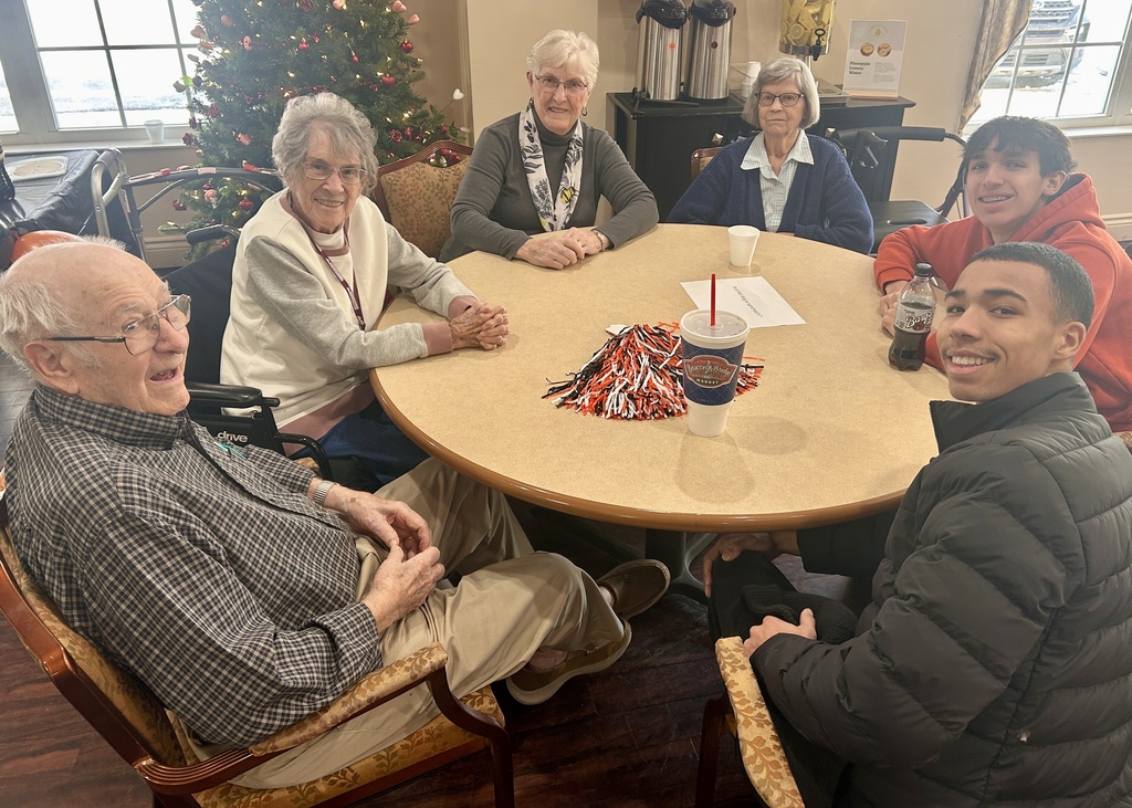 Varsity Boys Basketball team volunteering at Arbor Grove