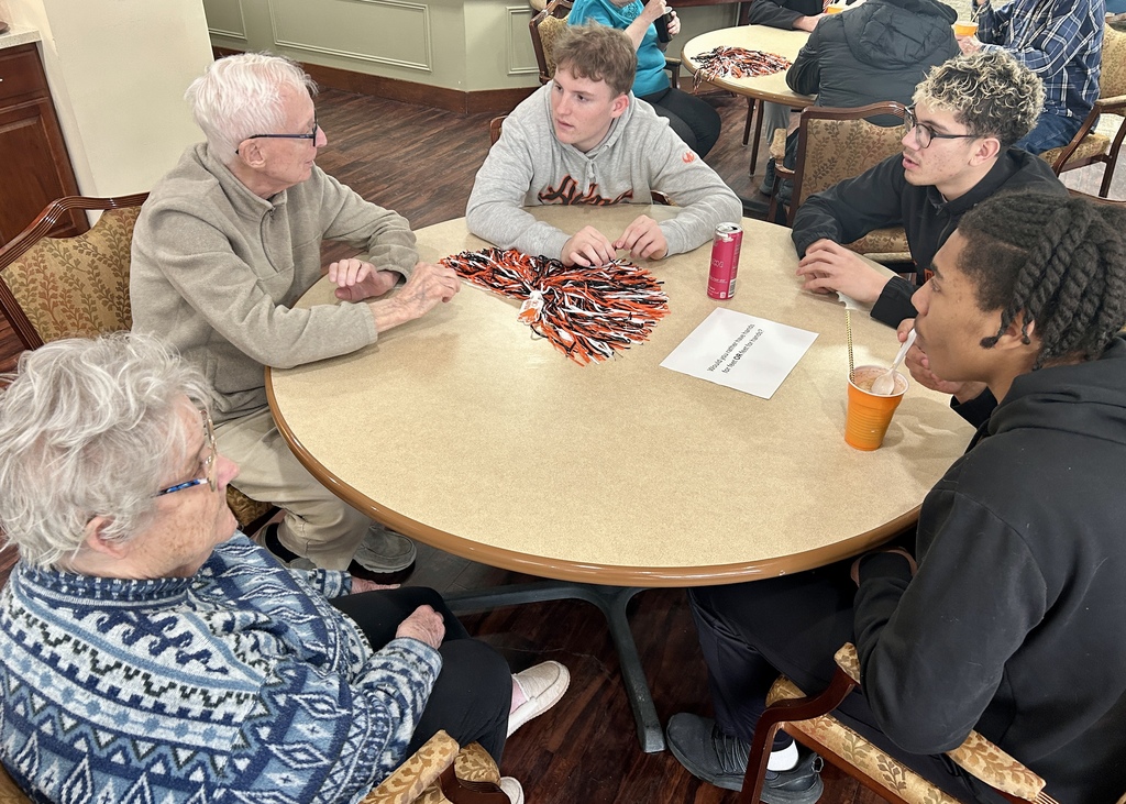 Varsity Boys Basketball team volunteering at Arbor Grove