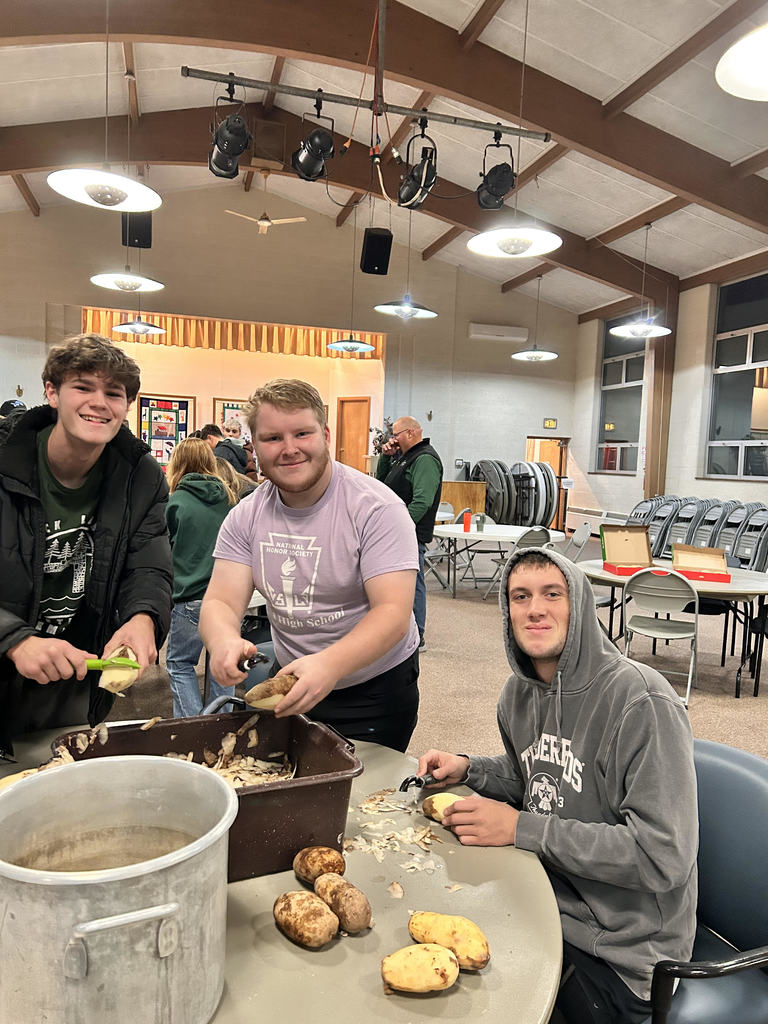 NHS peeling potatoes for Thanksgiving dinner