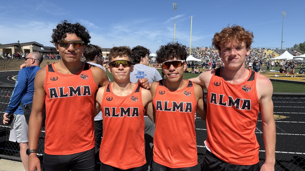 4 AHS All-State athletes pose together in uniforms