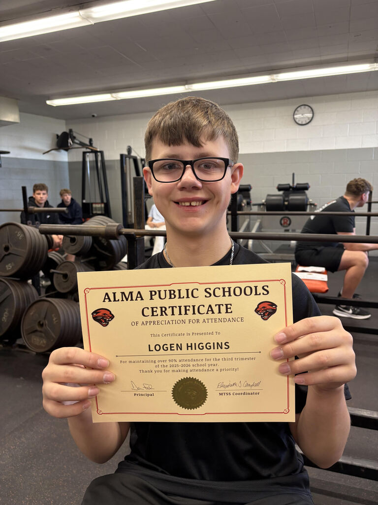 Student poses with attendance certificate