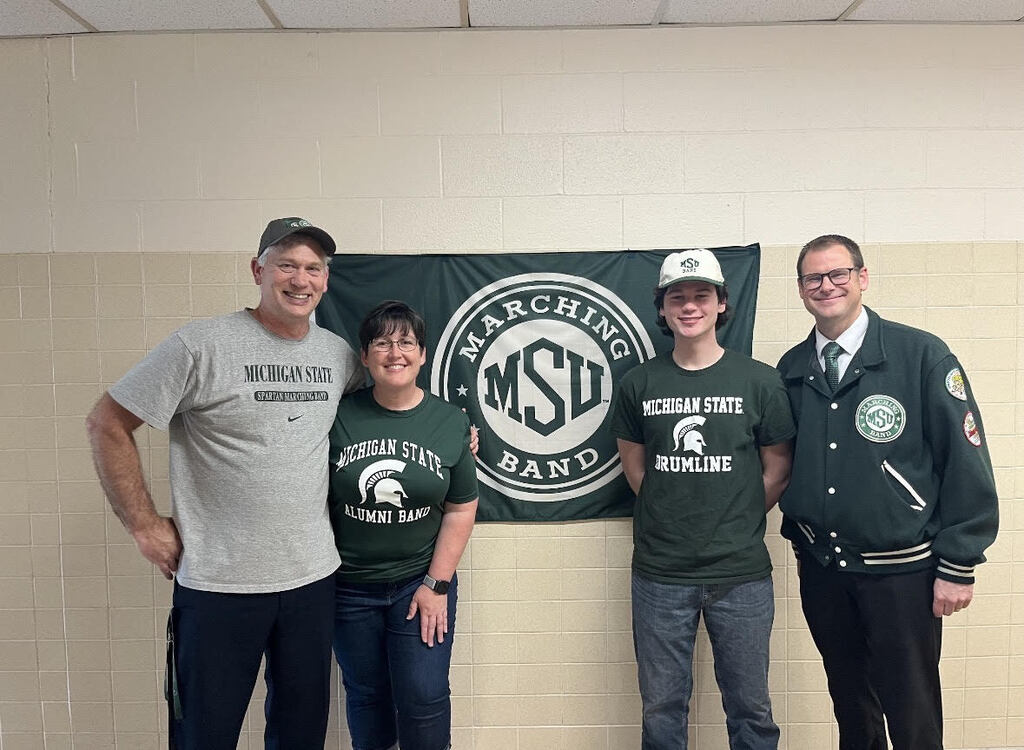 Zach with parents and Mr. Newman