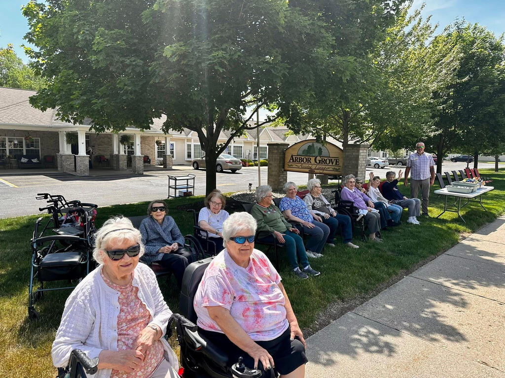 Arbor Grove residents with encouraging signs for students