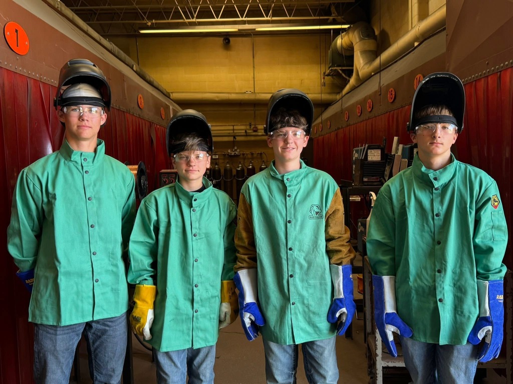 CTE summer camp middle school students in welding clothing