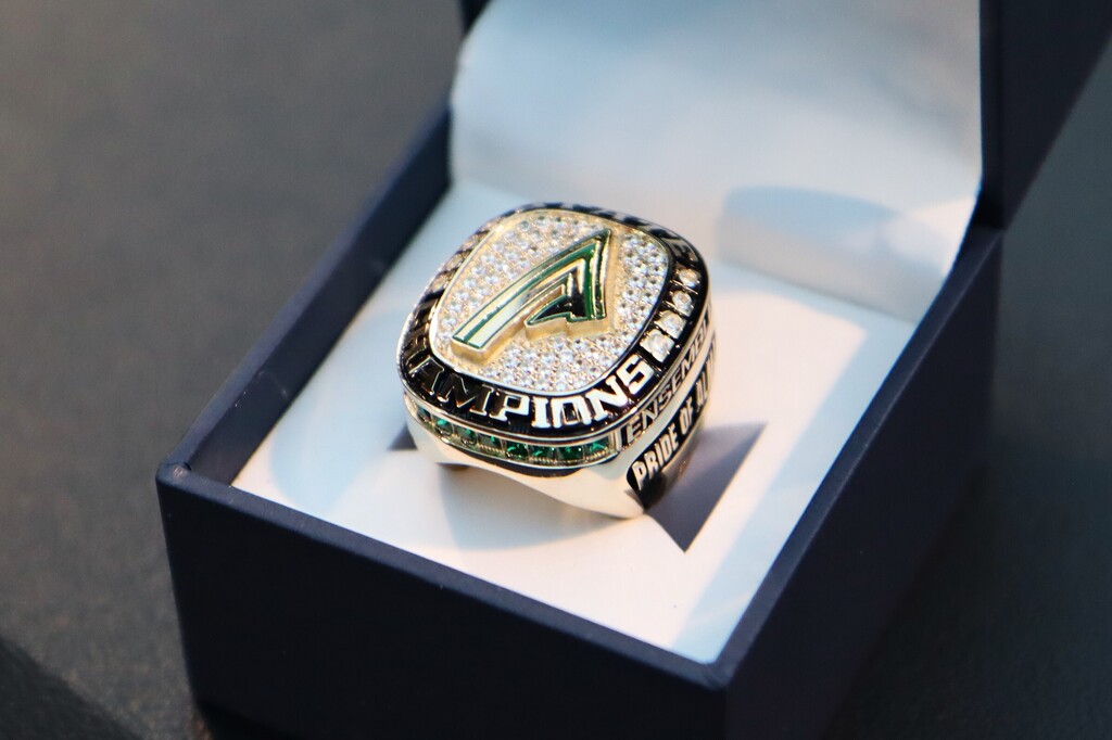 Current and former Alma High School Band directors presented championship rings to the students who made the achievement possible, including members who have since graduated.