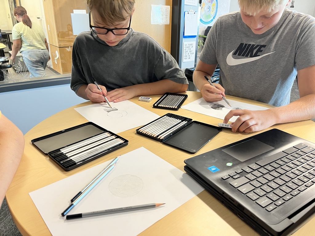 Drawing students working on their projects