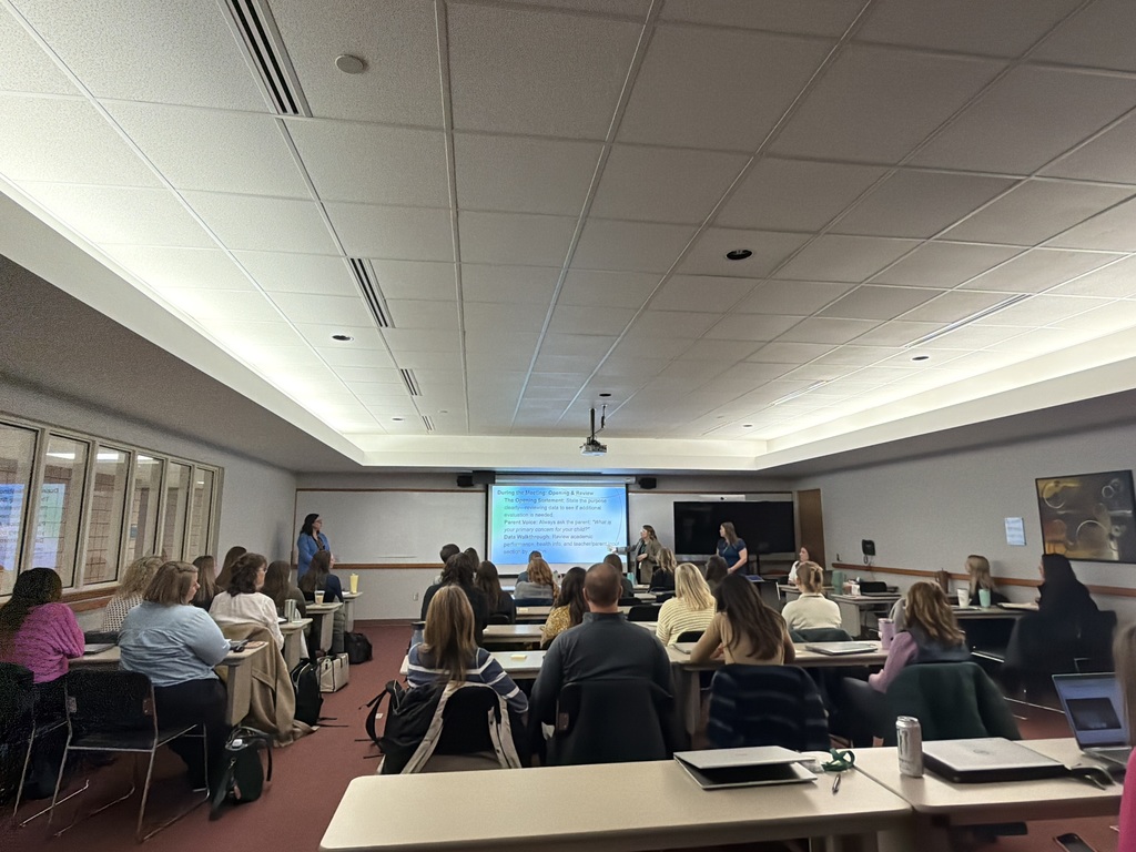 Staff facing screen during staff meeting 