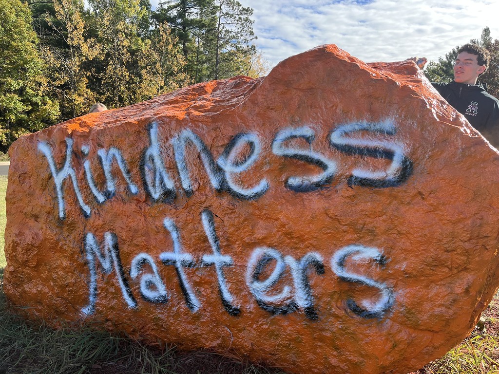 Leadership Students Painting the Rock at AHS for Unity Day in Kindness Month