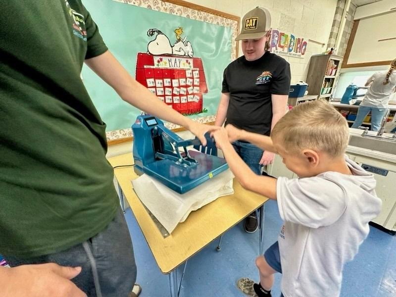 AMP UP Algebra/Manufacturing students work with Besser First Graders