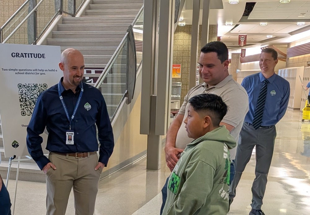 patrons speak with district leeaders at gratitude tour stop