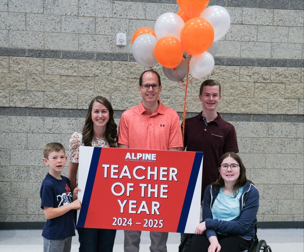 Aaron Anderson poses with family