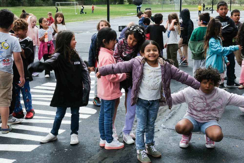 elementary students smiling on the playground