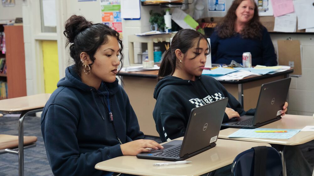 junior high students use laptops
