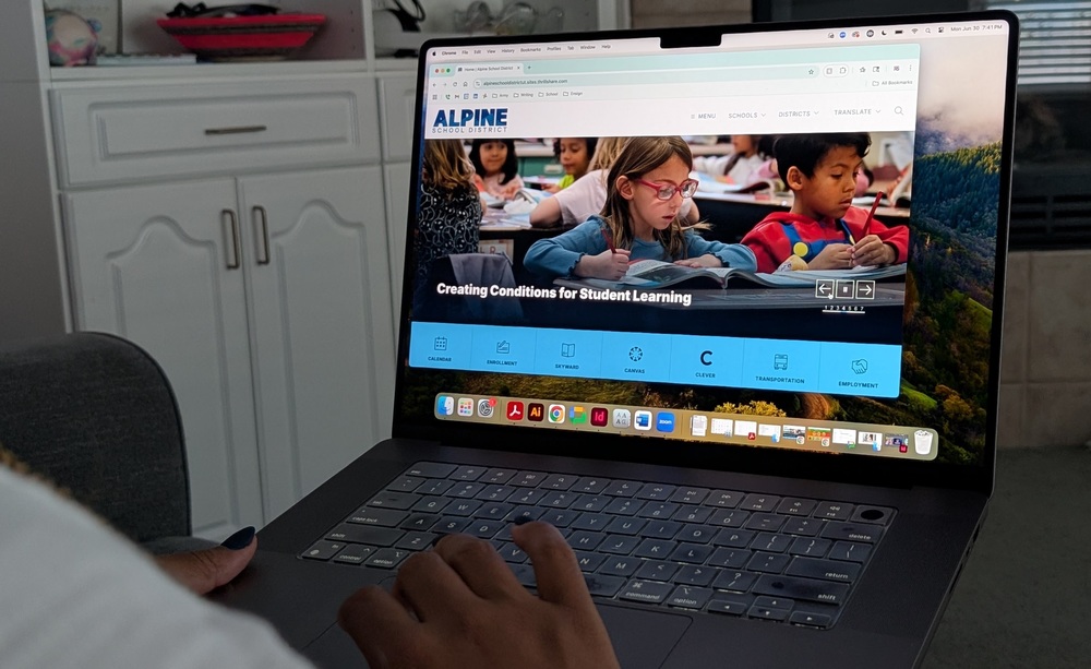 a woman navigates the district website