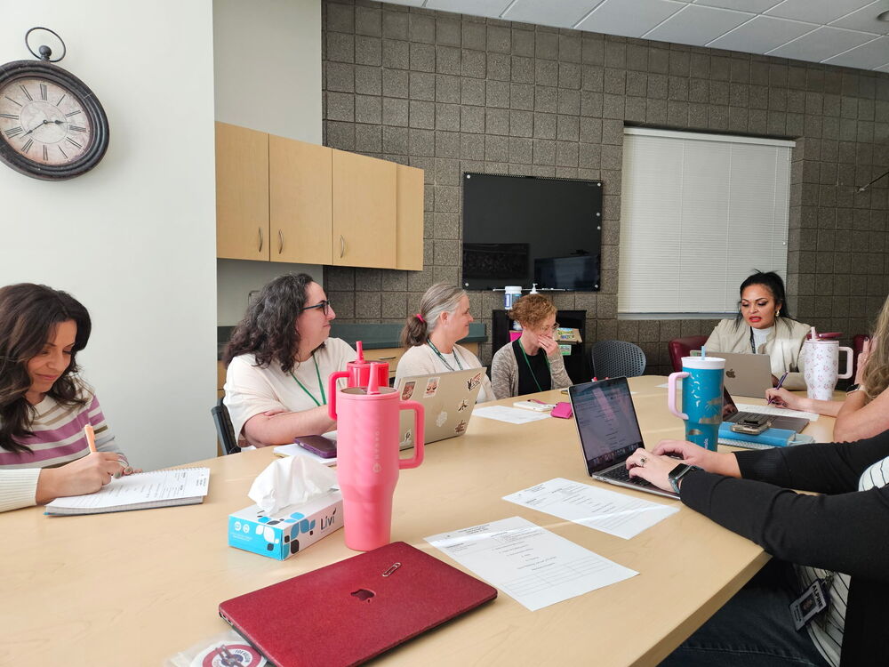 SCC meeting around a boardroom table
