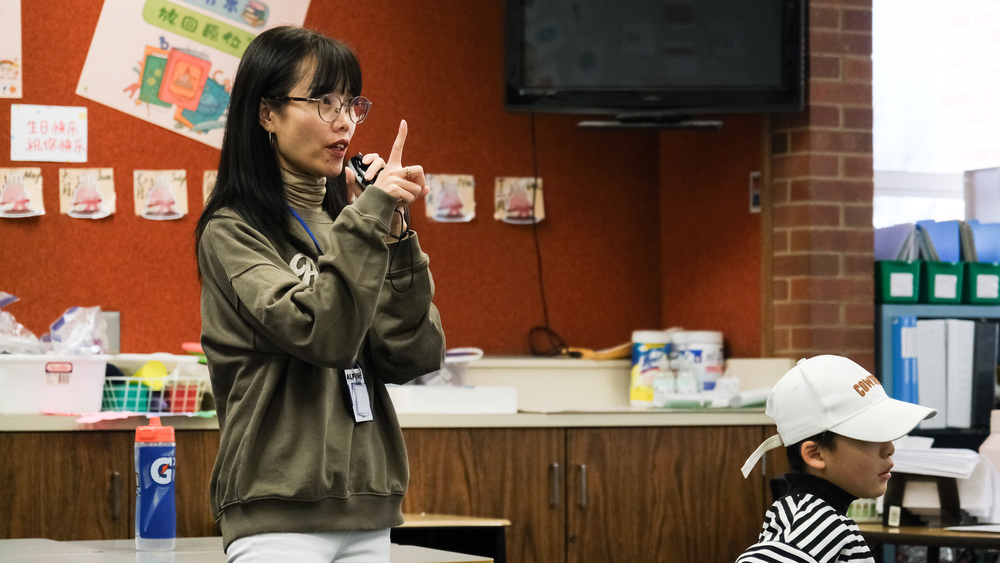 A chinese teacher presents in a classroom at Alpine Elementary
