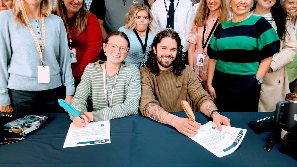 teacher apprentices signing documents