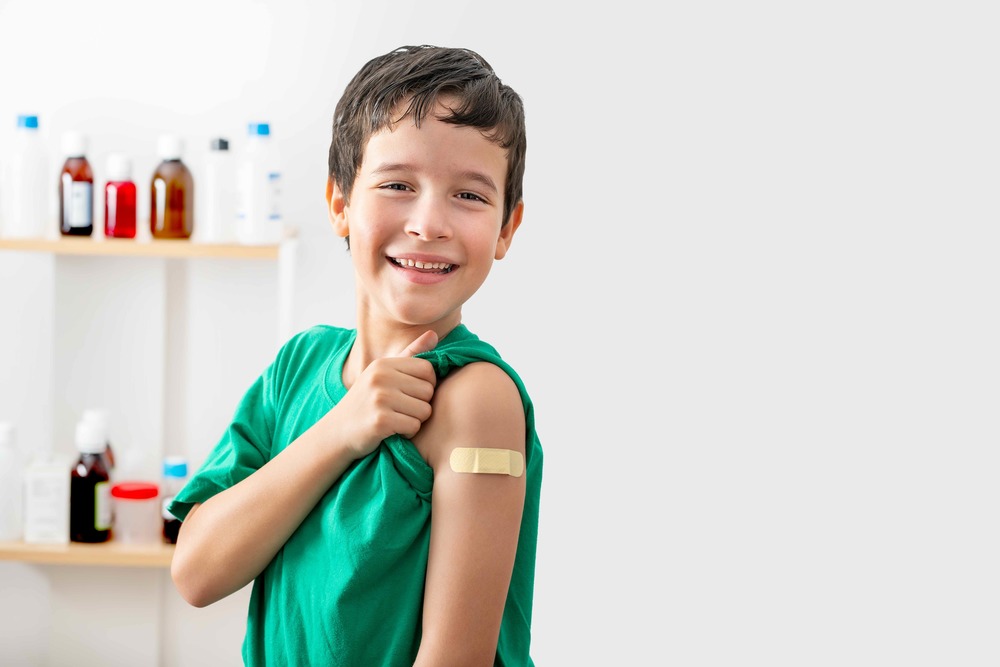 boy with a bandage on his arm