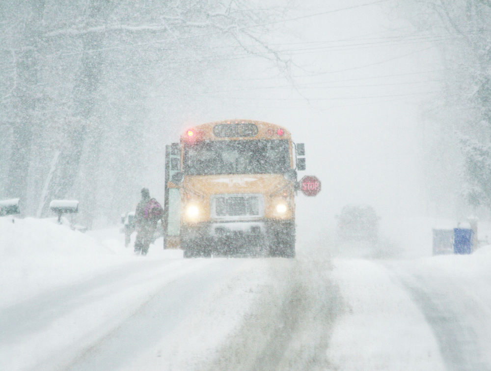 schoolbus driving in snow