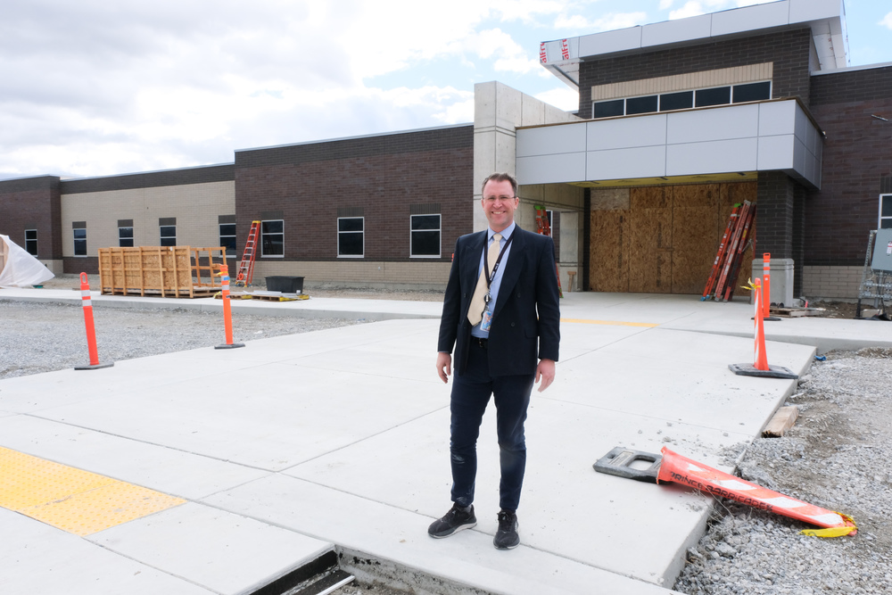 john emmit in front of the construction at new elementary