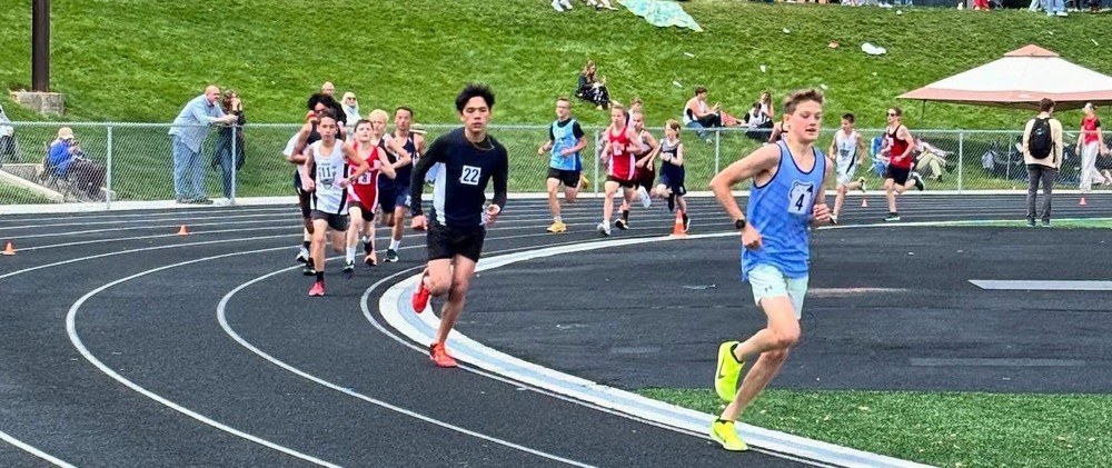 a student running during a track event.