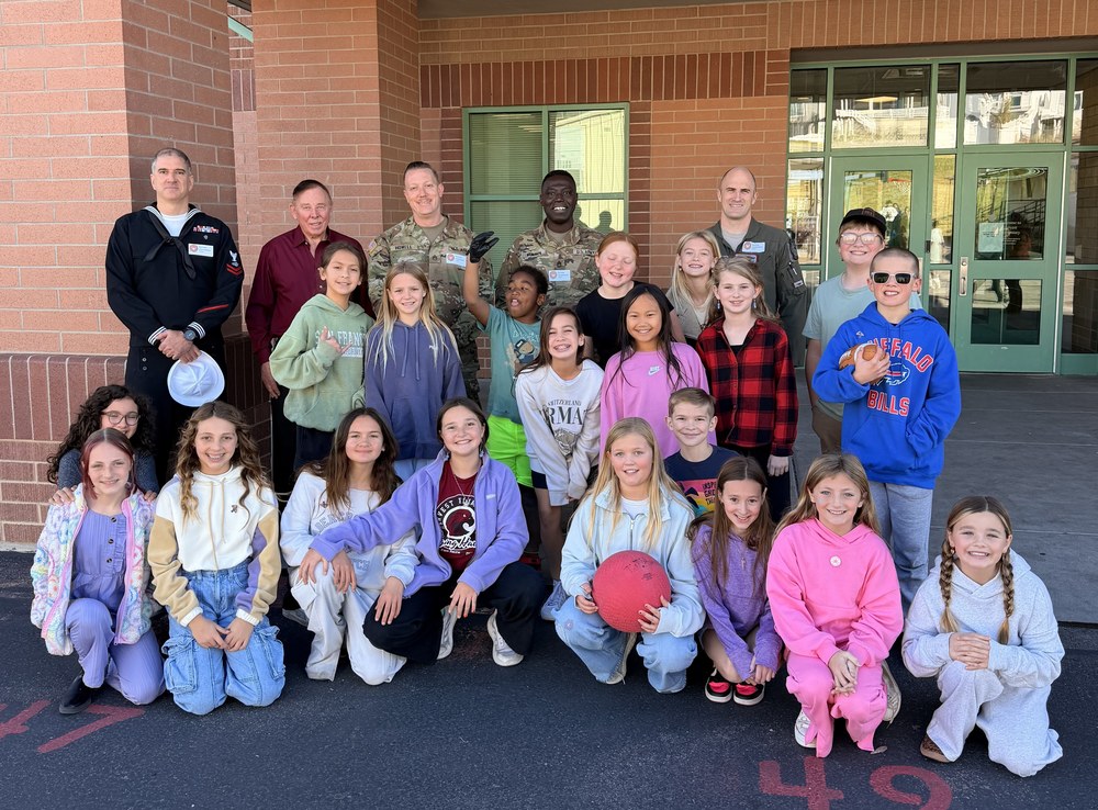 military students at harvest pose with their parents