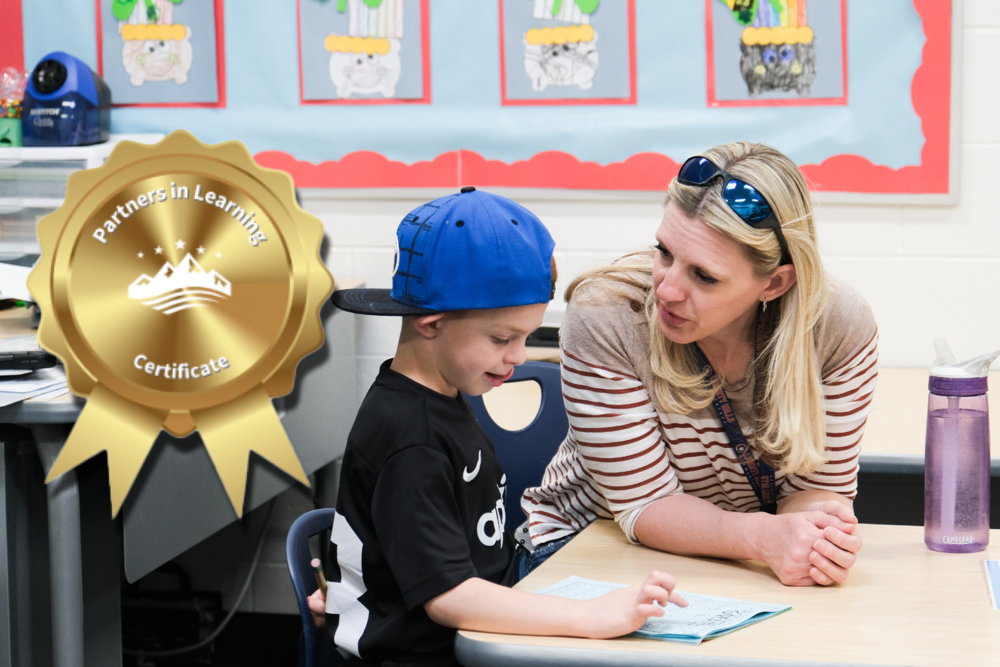 a parent works with a young student during a learning session