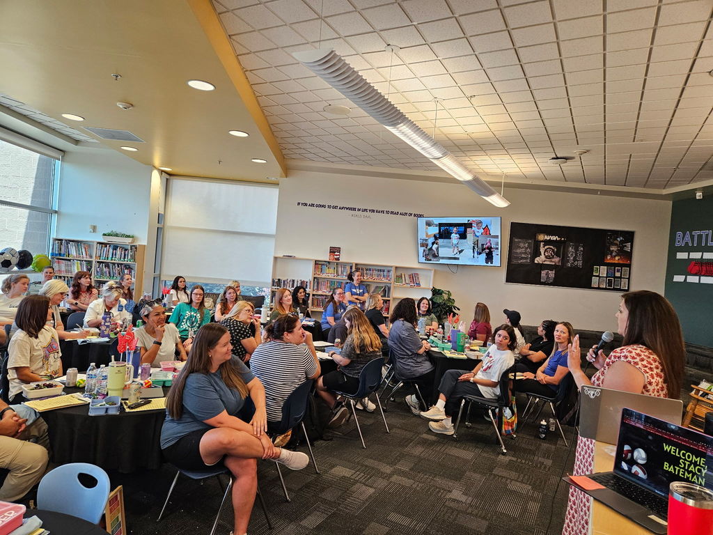 picture of people listening to someone speak