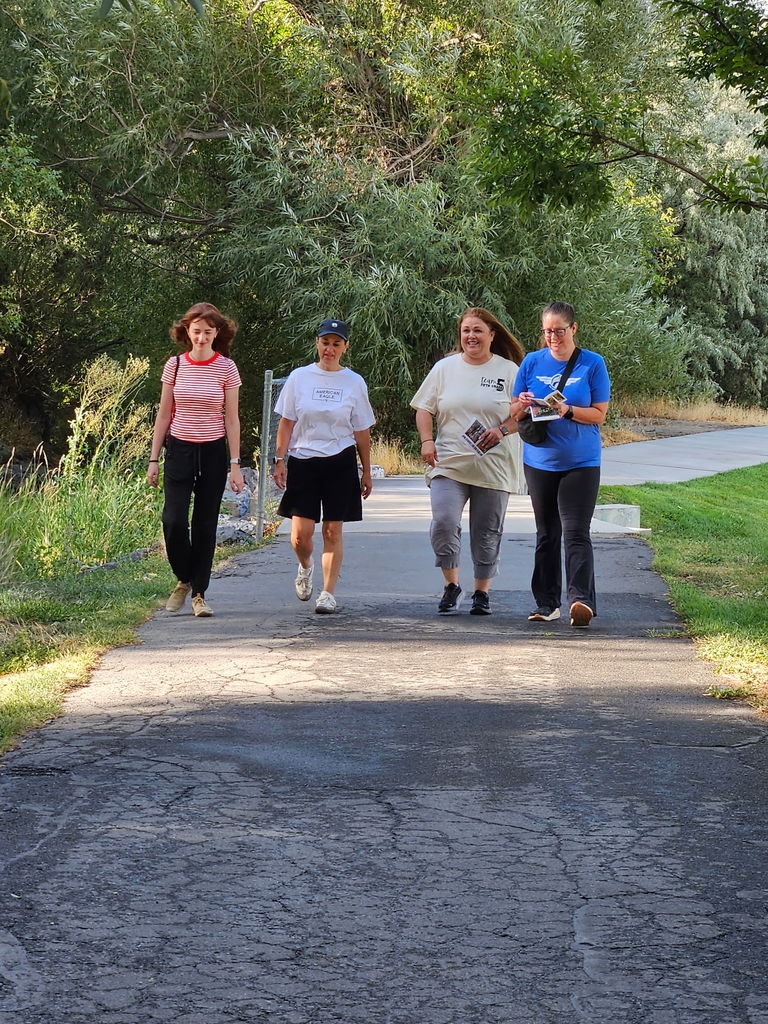 women walking down a path