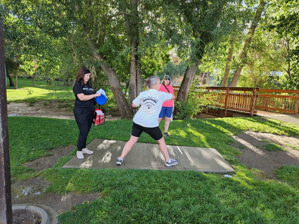 Women playing frisby golf