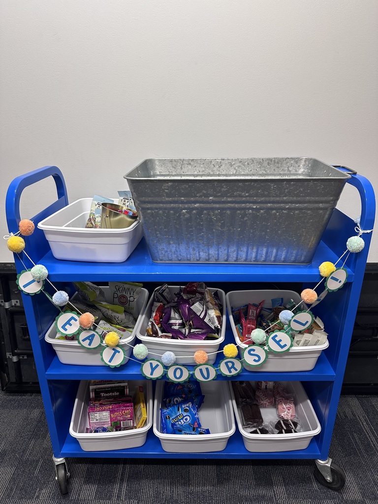 Blue cart with bins full of treats