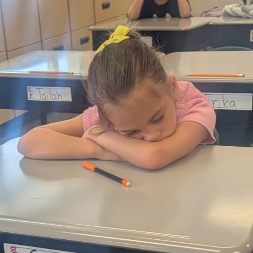 student asleep on desk