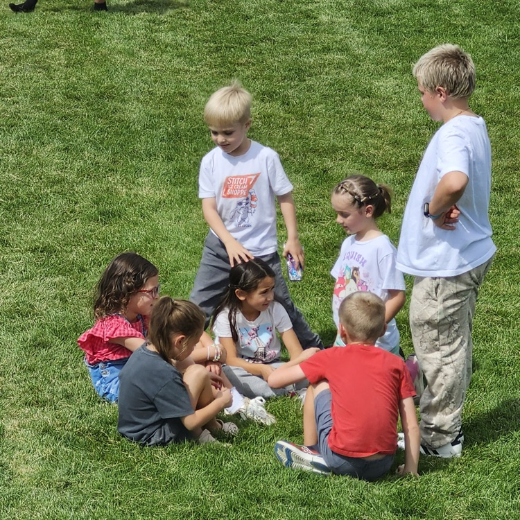 older students including younger students at play