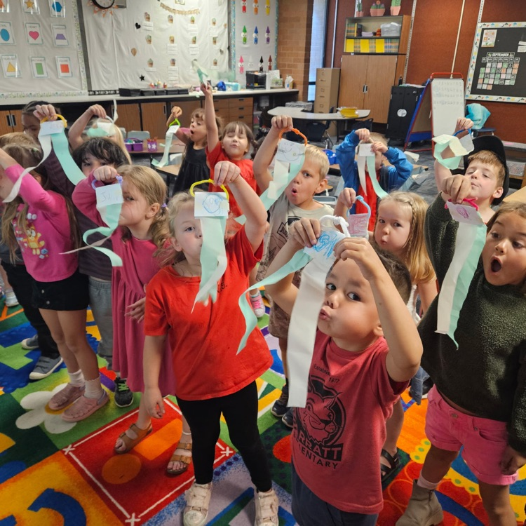 students standing on the carpet